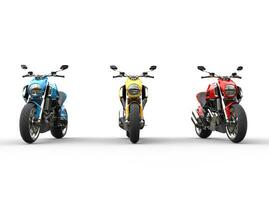 Three sports motorcycles in a row - front view - isolated on white background photo