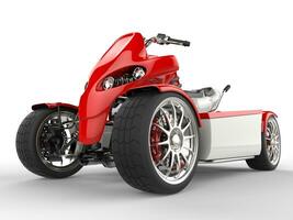 Modern red quad bike - front wheel extreme closeup shot photo