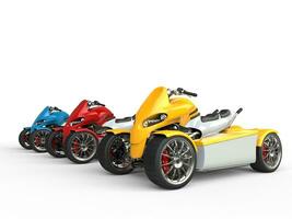 Electric all terrain vehicles - yellow one in focus photo