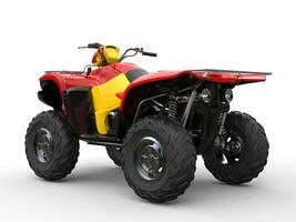 Red quad bike with yellow side panels - back view photo