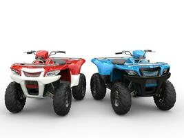 Red and blue quad bikes side by side photo