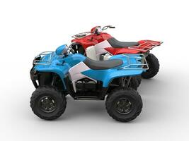 Red and blue quad bikes - side view photo