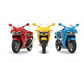 Red, yellow and blue modern super sports bikes - front view photo