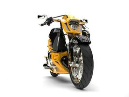 Sun yellow modern chopper motorcycle - front wheel closeup shot photo