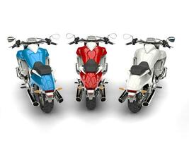 Awesome modern chopper bikes - red, wihte and blue - top down back view photo
