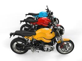 Modern red, blue and yellow chopper motorcycles - top down side view photo