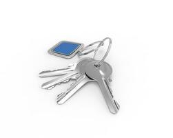 Keys on a keyring with blue pendant on white background, ideal for digital and print design. photo