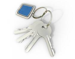 Keys with blue pendant on white background, ideal for digital and print design. photo