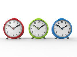 Red, green and blue alarm clocks photo