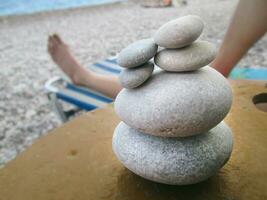 Small stacked rocks on the beach photo