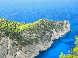 Small Peninsula with bright blue sea photo