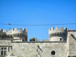 Ancient fort, two birds on a wire photo