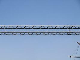 Metal girders - blue sky background photo