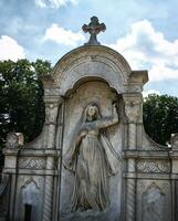 Beautiful gravestoe with arches and exquisite ornaments photo
