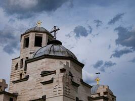 Stormy skies over orthodox church photo
