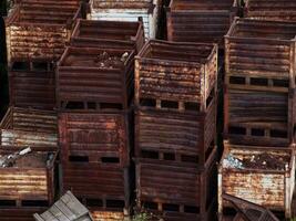 Discarded rusty metal storage boxes stacked photo