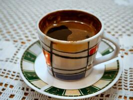 Cup of traditional Turkish coffee in a modern cup photo