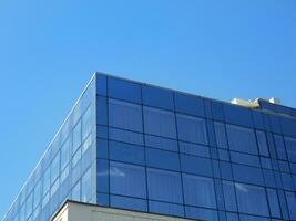 Modern business building - dark blue tinted glass windows photo