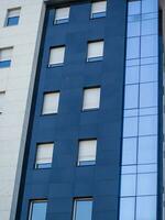 Side of the modern business building - metal and glass photo