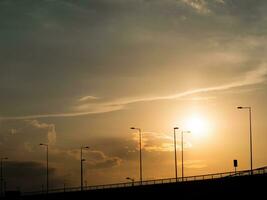 Modern highway at sunset photo