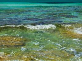 Amazing blue and green colors of the sea near the shore photo