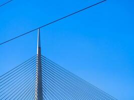 Top of big suspension bridge in Belgrade - clear sky background photo