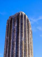 Ancient Greek column - clear sky background photo