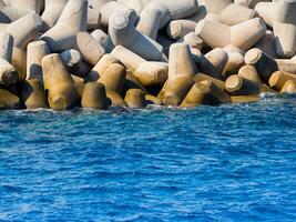 Huge concrete tetrapods near marina on Crete, Greece photo