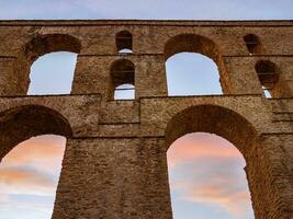 Ancient stone Roman aqueduct - Kavala, Greece photo