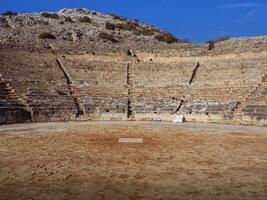 Beautiful ruins of a ancient Greek amphitheatre photo