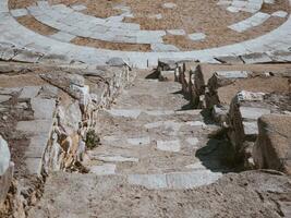 Stair steps of the ancient amphitheatre in Greece photo