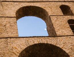 Detail of arcs and brickwork of stunning architecture - Ancient Roman aqueduct in Greece photo