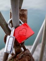 Lover padlocks on the bridge - detail shot photo