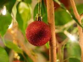Shiny glittering red Christmas bauble ornament photo