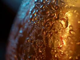 Drops of condensation on a bottle - closeup shot photo
