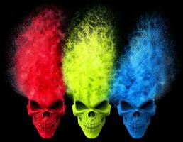 Angry skulls - red, green and blue - exploding into particles photo