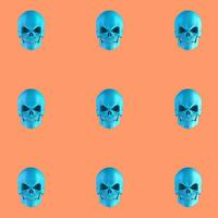 Pattern of blue skulls on orange background photo