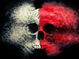 Red and white skull exploding into tiny particles photo