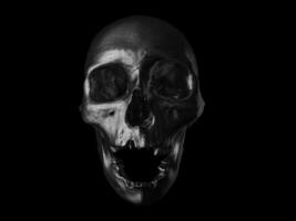 Oil black human skull with open jaw and missing teeth - front view photo