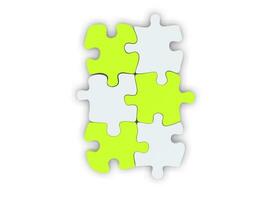 White and fresh green puzzle pieces set together photo