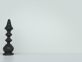 Black chess piece on white background photo