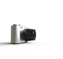 Small silver camera on white background - far shot, ideal for digital and print design. photo