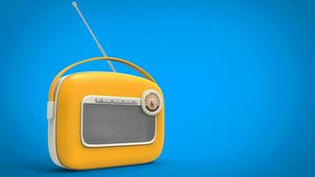Yellow vintage radio on light blue background photo