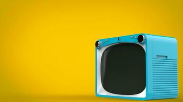 Pale blue retro style TV set on yellow background photo