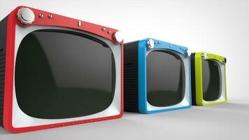 Black retro TV sets with red, blue and green fronts - closeup shot photo