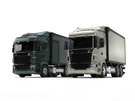 Modern metallic heavy transport trucks - light and dark photo