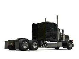 Black long haul semi - trailer big truck - back view photo