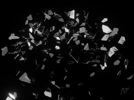 Pieces of shattered glass flying in the air photo