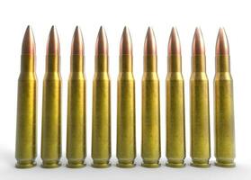 Set of rifle bullets on white background photo