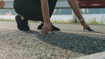 A young woman runner runs at sunset in a park in the park. video